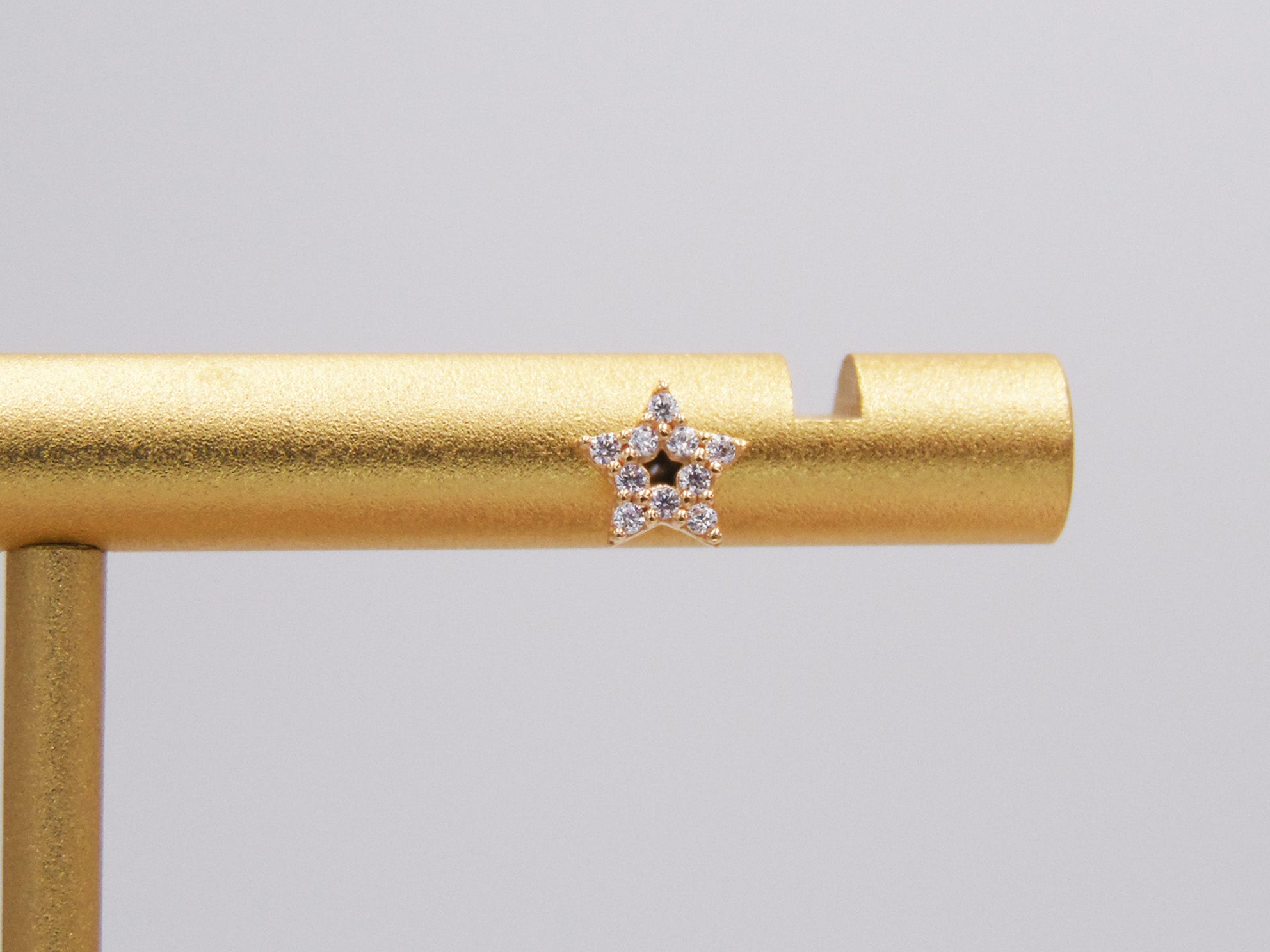 STAR STUD WITH GOLDEN ZIRCONIAS