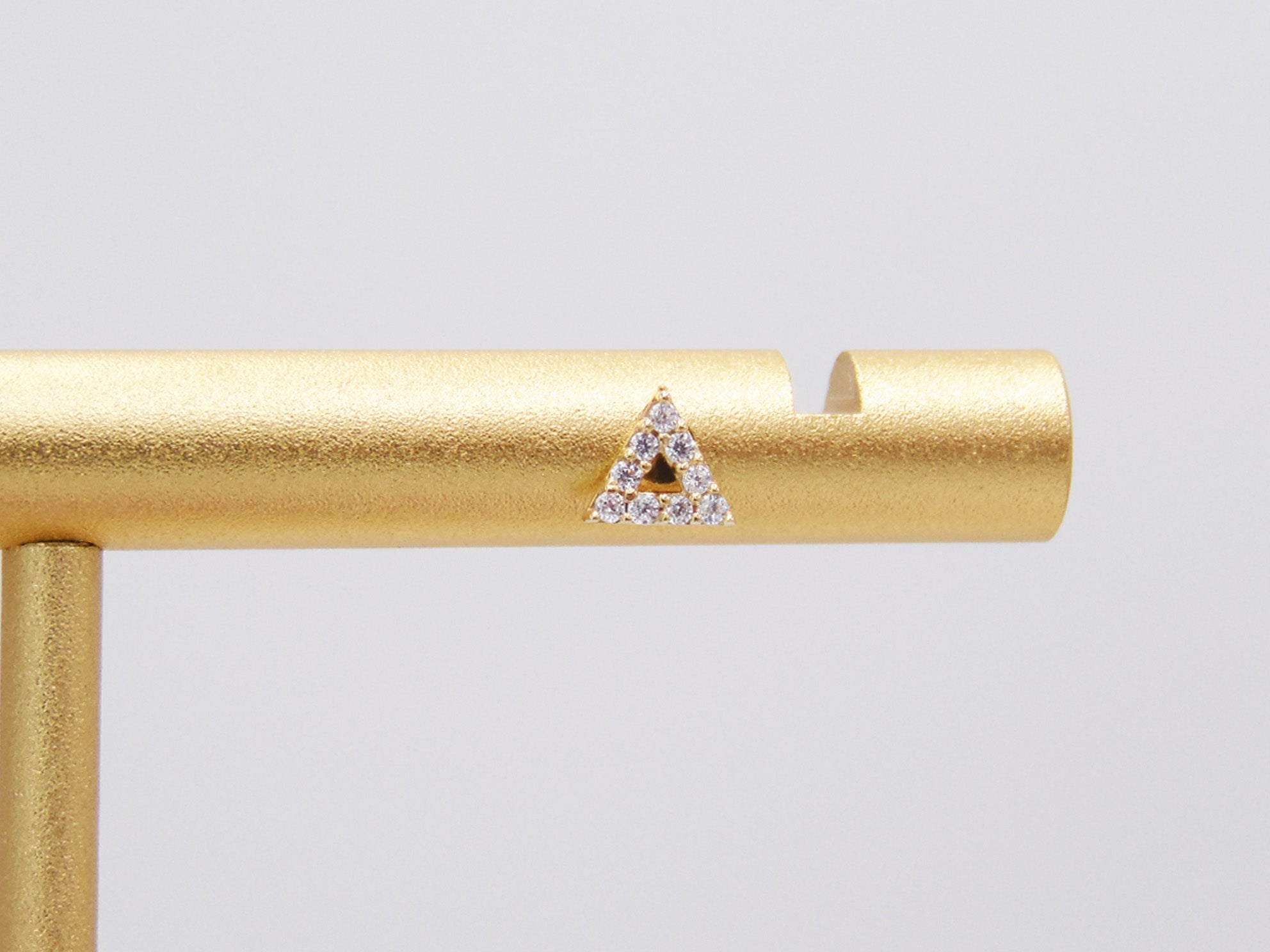 TRIANGLE STUD WITH GOLDEN ZIRCONIAS