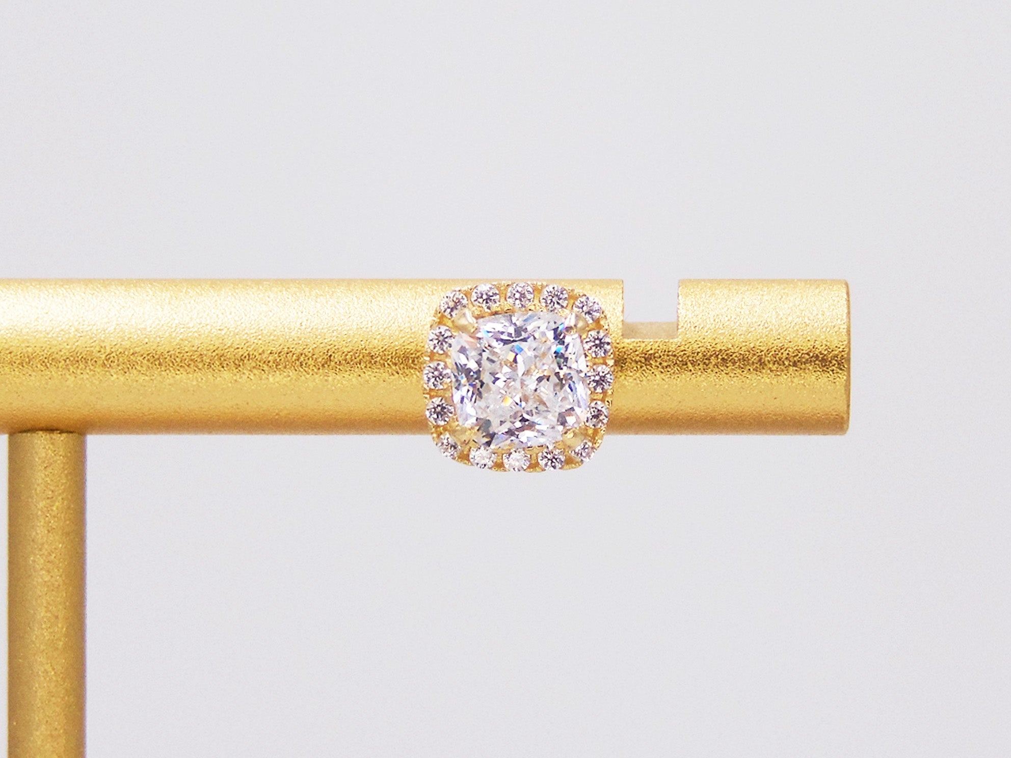 STONE CUSHION STUD WITH GOLDEN ZIRCONIAS